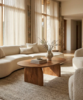 Modern living room with a wooden coffee table and beige sofa.
