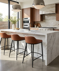 Modern kitchen with marble island and bar stools