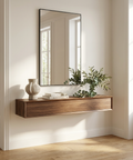 Wooden console table with mirror and decorative items in a bright room.