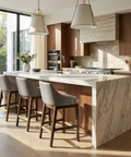 Modern kitchen with marble island and wooden chairs