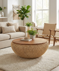 Living room with beige sofa, wooden coffee table, and chairs.