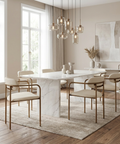 Modern dining room with marble table and gold chairs