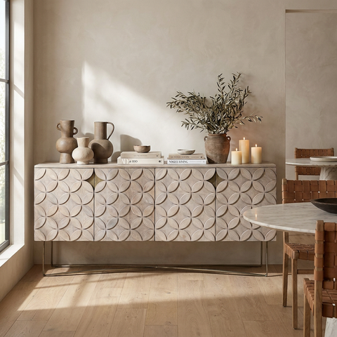 Decorative sideboard with textured design in a room with a table and chairs.