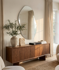 Wooden sideboard with decorative items in a living room setting