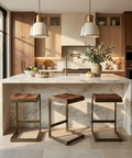 Modern kitchen with marble island and wooden stools