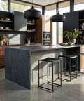 Modern kitchen with marble island and black pendant lights