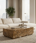 Modern living room with a beige sectional sofa and marble coffee table.