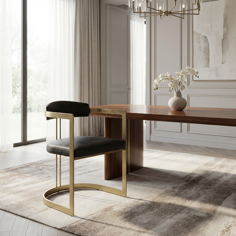 Modern dining room with wooden table and chair, decorative elements, and large windows.